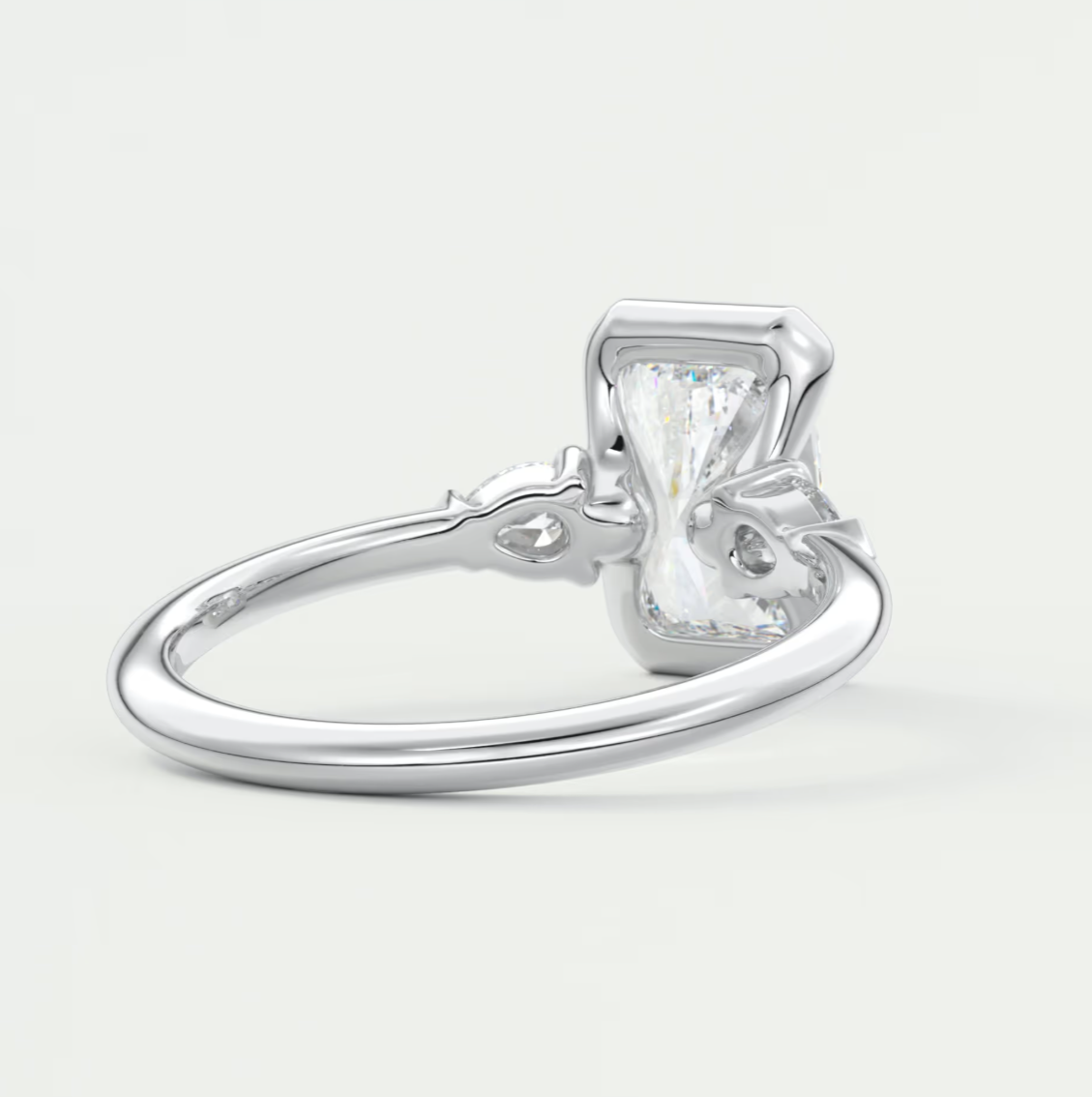 Custom made solara elongated radiant half bezel three-stone engagement ring | diamond lab