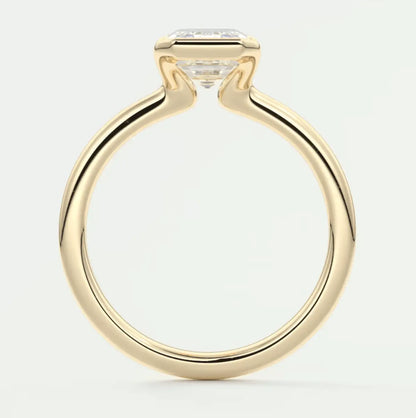 18k yellow gold engagement ring with a princess cut diamond.