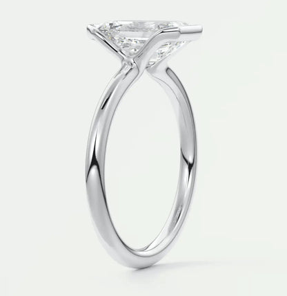18-karat white gold princess-cut diamond engagement ring.