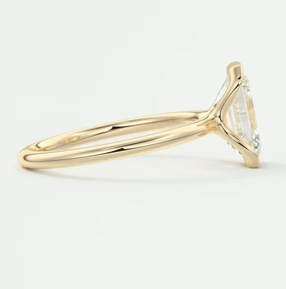 18k yellow gold engagement ring with a marquise-cut diamond.