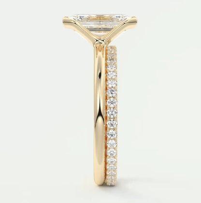 18k yellow gold engagement ring with princess cut diamond and pave set diamonds on band.