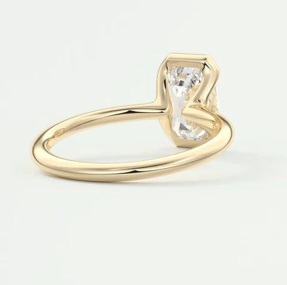 18k yellow gold engagement ring with a princess cut diamond.