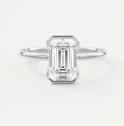18k white gold emerald cut diamond engagement ring.