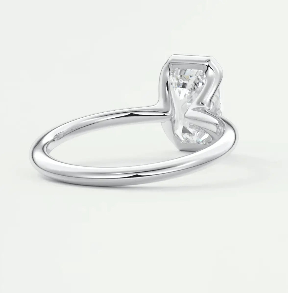 18k white gold solitaire engagement ring with a princess cut diamond.