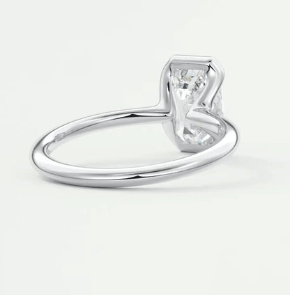 18k white gold solitaire engagement ring with a princess cut diamond.