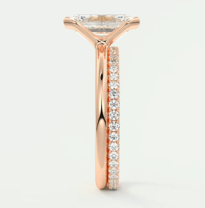 18k rose gold engagement ring with princess cut diamond and pave set diamonds on band.