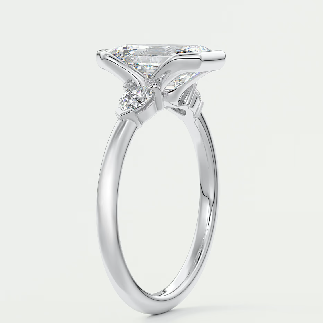 Custom made solara emerald half bezel three-stone engagement ring | diamond lab