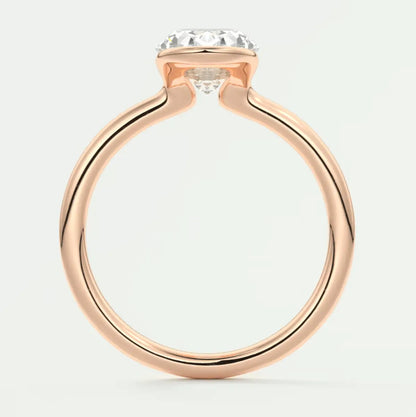 Rose gold diamond engagement ring with a cushion-cut center stone.