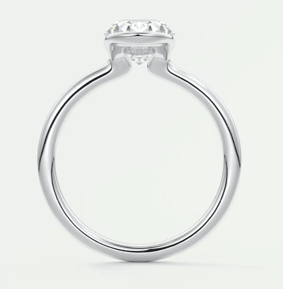 White gold solitaire diamond engagement ring with a round brilliant cut stone.