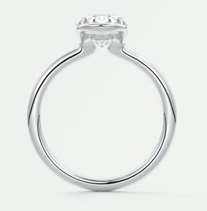 White gold solitaire diamond engagement ring with a round brilliant cut stone.