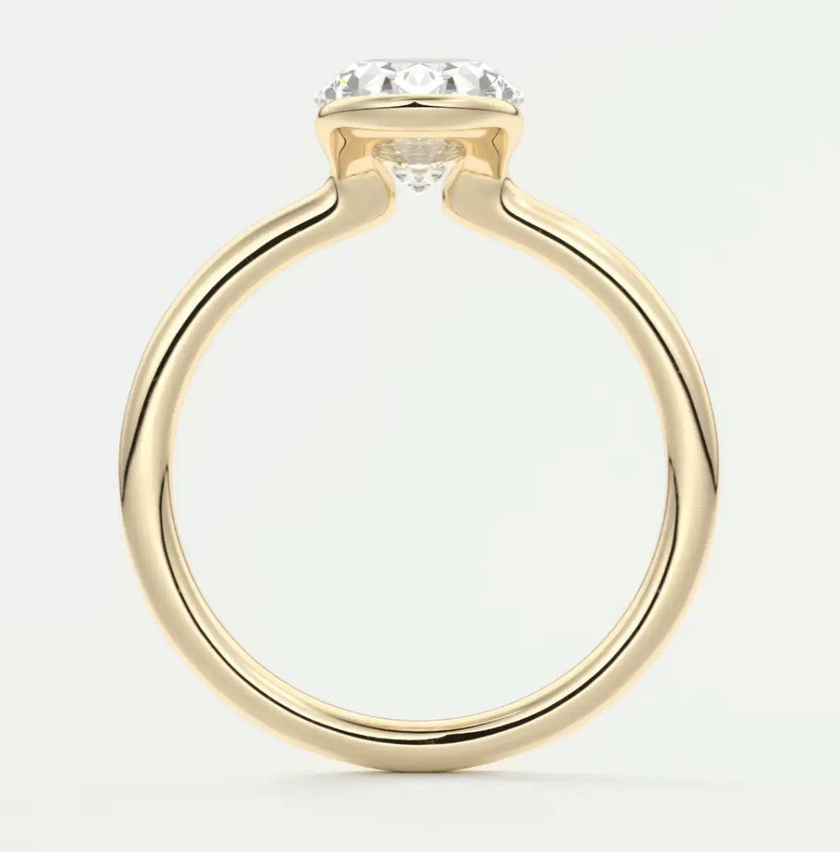 18-karat yellow gold engagement ring with a round diamond.