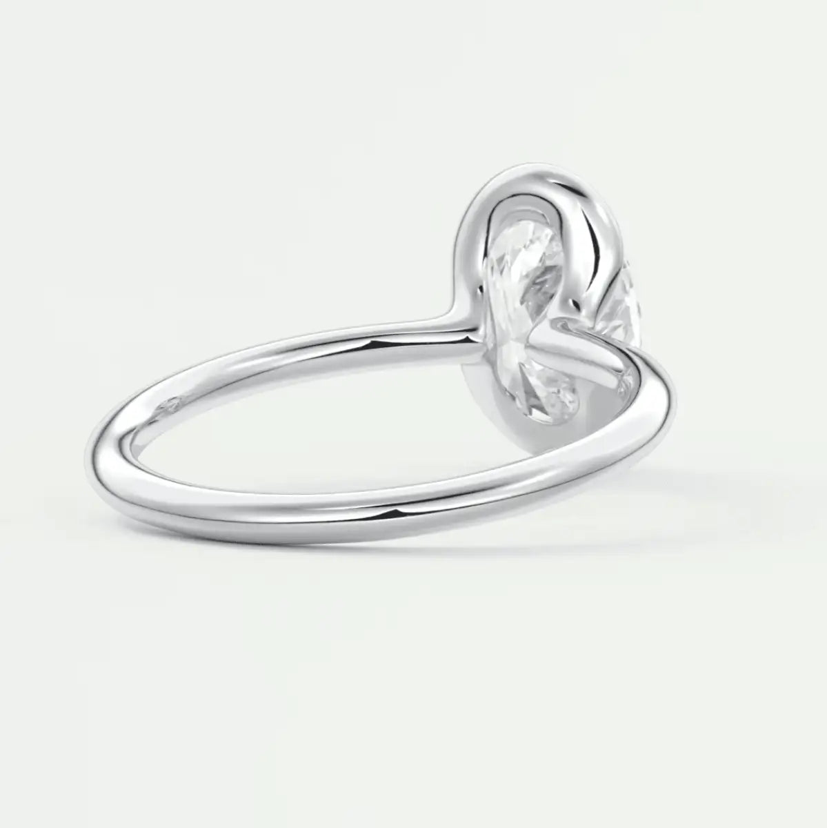 Silver heart-shaped diamond engagement ring with a solitaire setting.