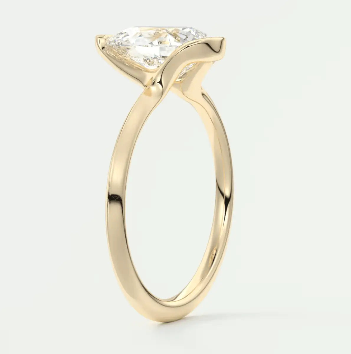 18-karat yellow gold engagement ring with a princess-cut diamond.