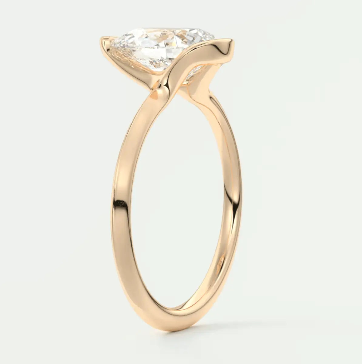 18-karat rose gold engagement ring with a princess-cut diamond.