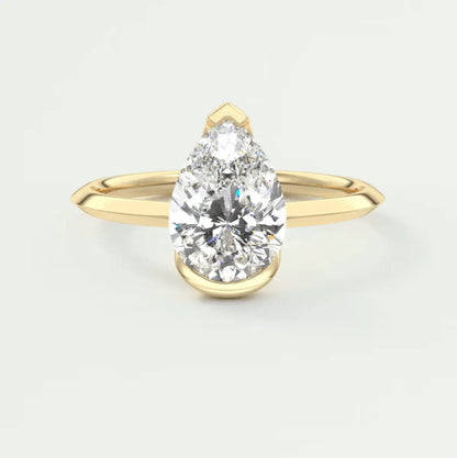 Pear-shaped diamond engagement ring with yellow gold band, elegant design.
