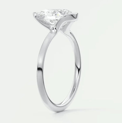 Princess cut diamond engagement ring with a white gold band.