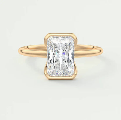 18k yellow gold engagement ring with a radiant cut diamond.