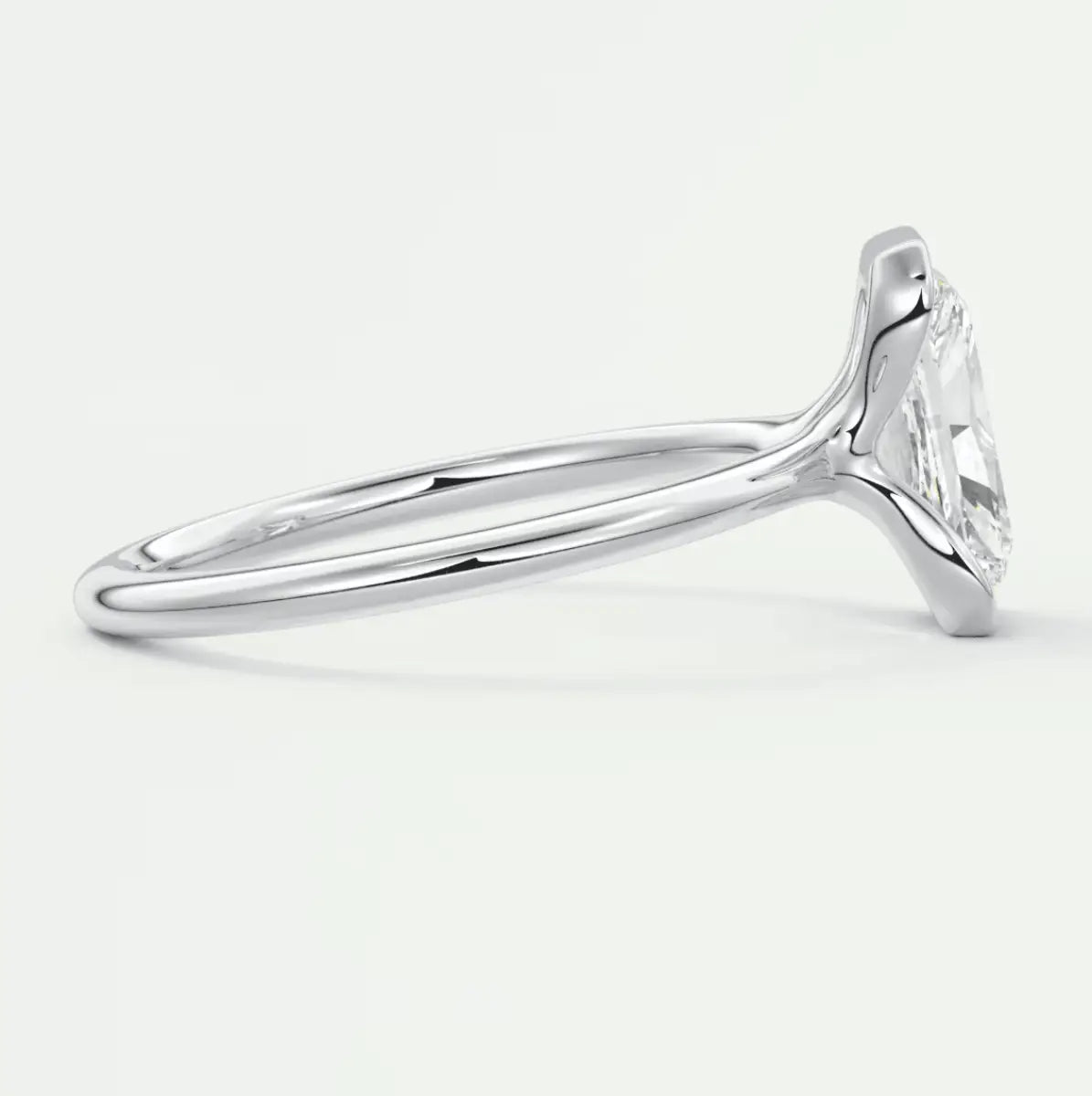 18-karat white gold engagement ring with a princess-cut diamond.