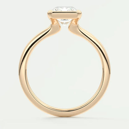 18-karat gold engagement ring with a round diamond.