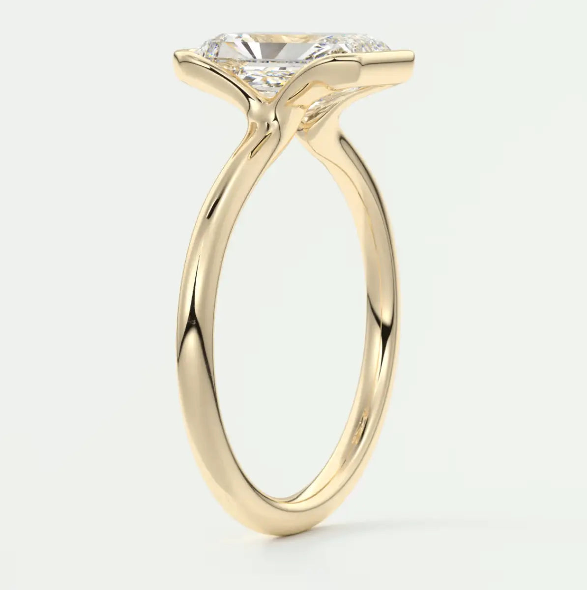 18k yellow gold engagement ring with a round diamond.