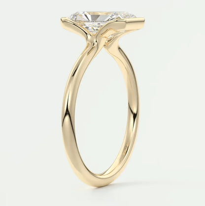 18k yellow gold engagement ring with a round diamond.