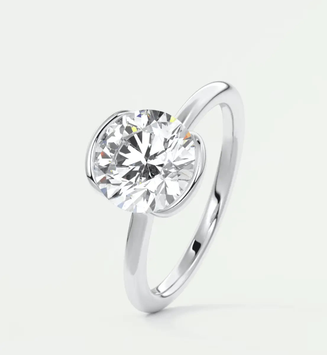 18-karat white gold solitaire diamond engagement ring.