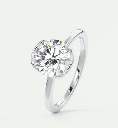 18-karat white gold solitaire diamond engagement ring.