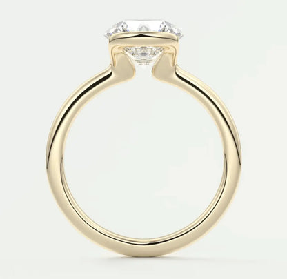 18k yellow gold engagement ring with a princess cut diamond and two smaller diamonds on either side.