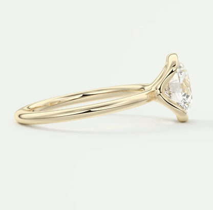 18k yellow gold solitaire engagement ring with a round diamond.