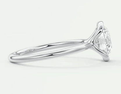 Pear-shaped diamond engagement ring with a white gold band.