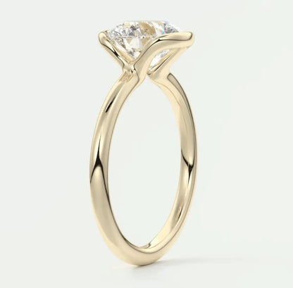 18-karat yellow gold solitaire engagement ring with a princess-cut diamond.
