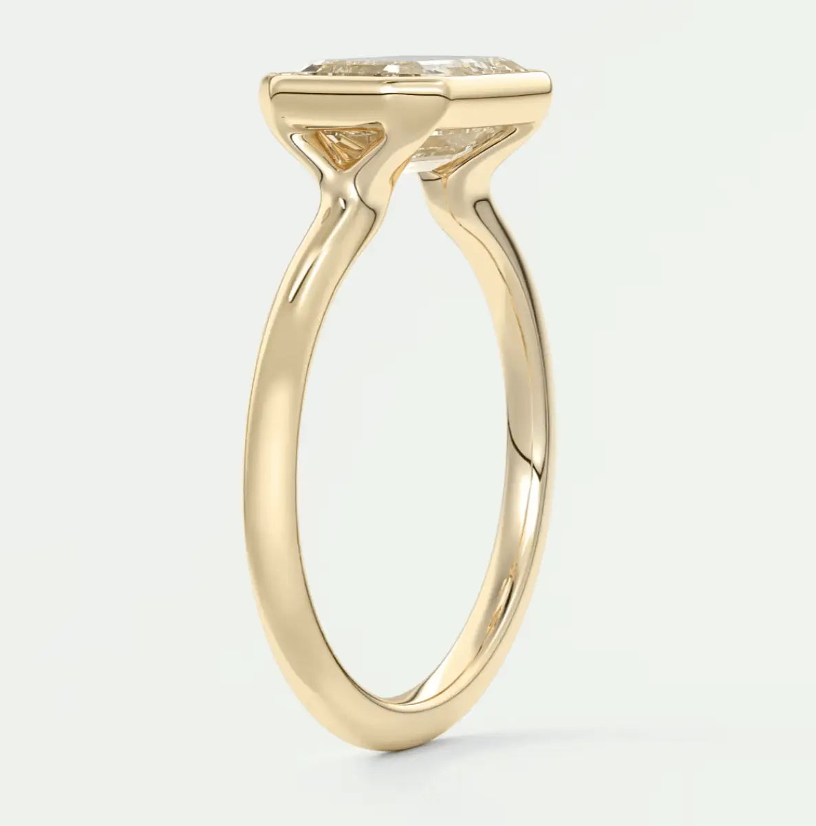 18k yellow gold engagement ring with a cushion-cut diamond.