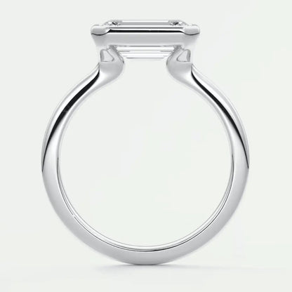 White gold engagement ring with a square diamond.