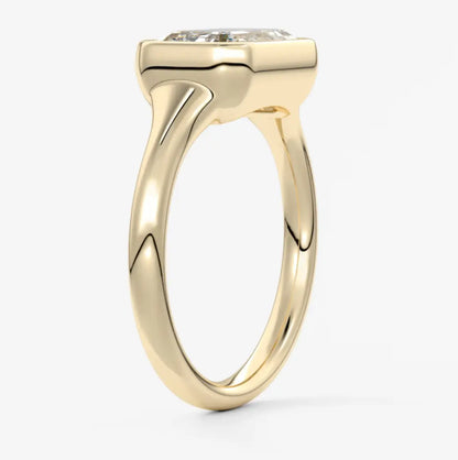 Yellow gold engagement ring with a cushion-cut diamond.