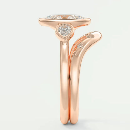 Rose gold diamond engagement ring with a halo design and three small diamonds on the band.