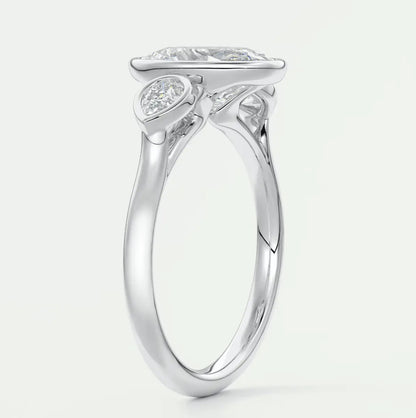 18k white gold engagement ring with a cushion-cut diamond and small accent diamonds.
