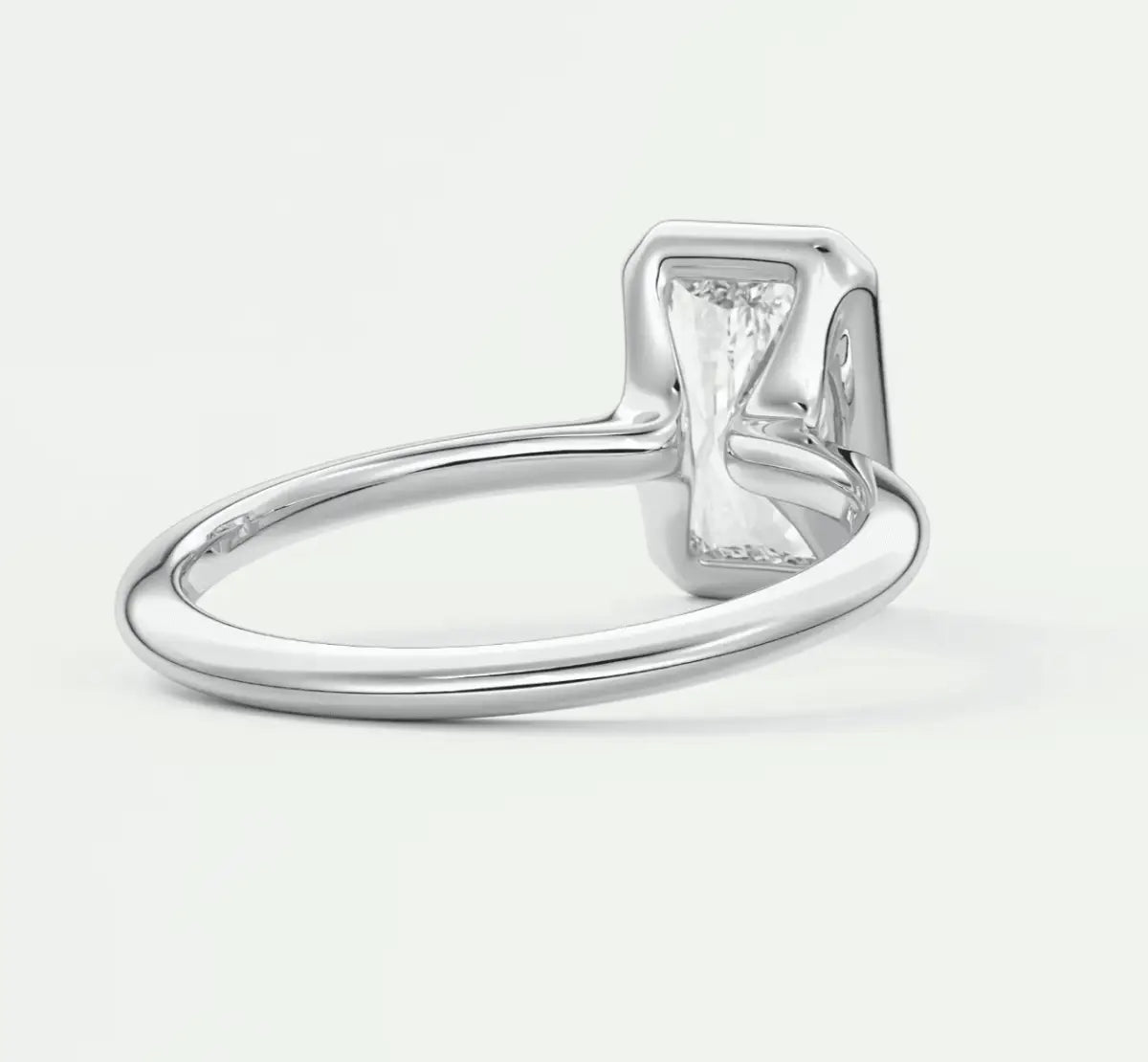 Silver rectangular diamond engagement ring with a modern design.