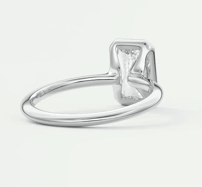 Silver rectangular diamond engagement ring with a modern design.