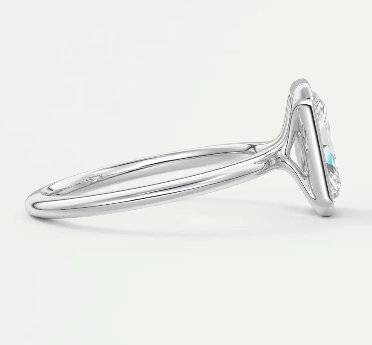 18k white gold diamond engagement ring with a marquise-shaped center stone and turquoise accents.