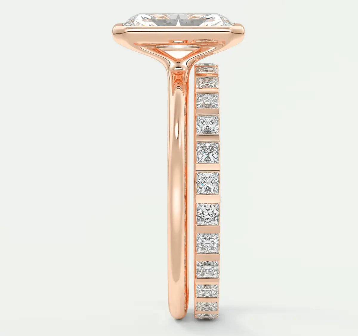 18k rose gold engagement ring with princess-cut diamond center stone and channel-set diamonds on the band.