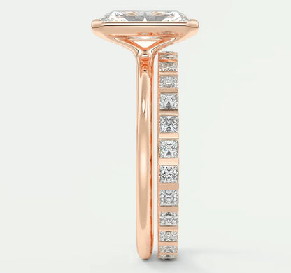 18k rose gold engagement ring with princess-cut diamond center stone and channel-set diamonds on the band.